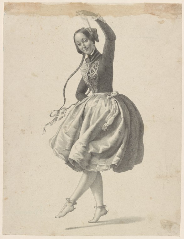 Female dancer in dark fitted jacket and voluminous skirt captured mid-turn, left arm raised, in 19th-century ballet pose.