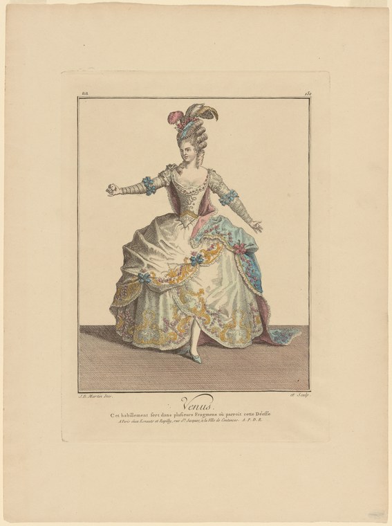 A woman in an elaborate 1780s court dress with gold embroidery and jewels, wearing a tall feathered headdress, stands with one arm raised in an elegant gesture.