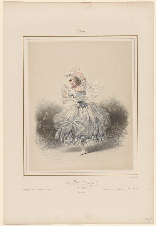 Woman in a long white tulle skirt, arms raised, caught mid-pirouette on a bare stage in soft shadow