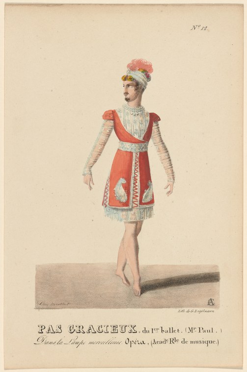 A female dancer in profile wearing a red tunic, white pleated skirt, and a tall feathered headdress, standing with arms at her sides.