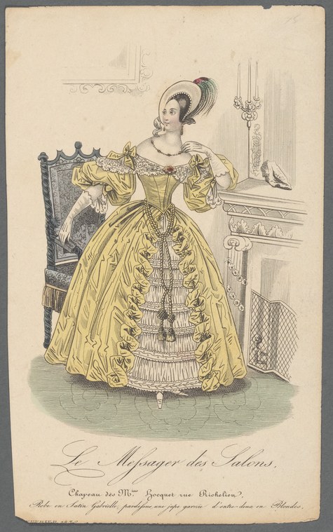 Woman in pale yellow ball gown with ornate bodice and pleated skirt standing in formal salon, wearing feathered headdress, circa 1840s.