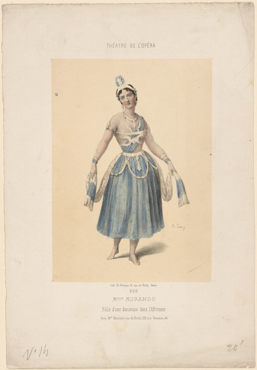 A female dancer in elaborate white and gold bodice and pale blue silk skirt with ornate feathered headdress, standing in frontal pose.