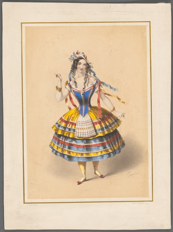 A woman in elaborate folk costume with tiered colored skirt, blue corset, and floral coronet stands in formal pose with right arm raised.