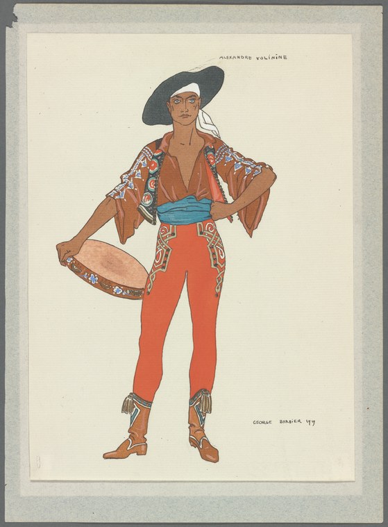 Male dancer in broad black hat, embroidered brown jacket, and red tights with spurred boots, standing in composed display pose.