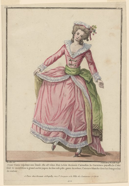 Young woman in pink silk gown with green shawl, standing in refined pose with extended arm, rehearsing a dance.