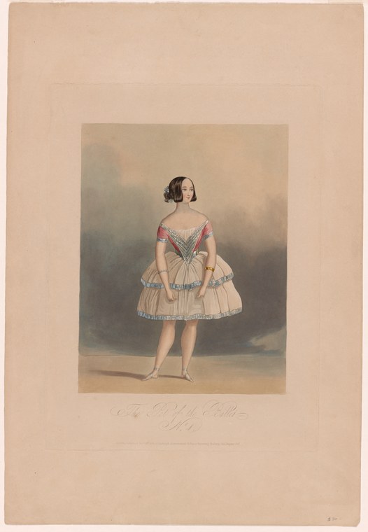 A young woman in a pale tulle ballet dress with red ribbon trim stands in a formal pose against a soft atmospheric backdrop.