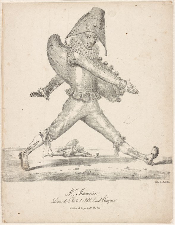 Male dancer in tall hat and striped tunic in an exuberant wide-legged pose with arms spread, mid-leap.