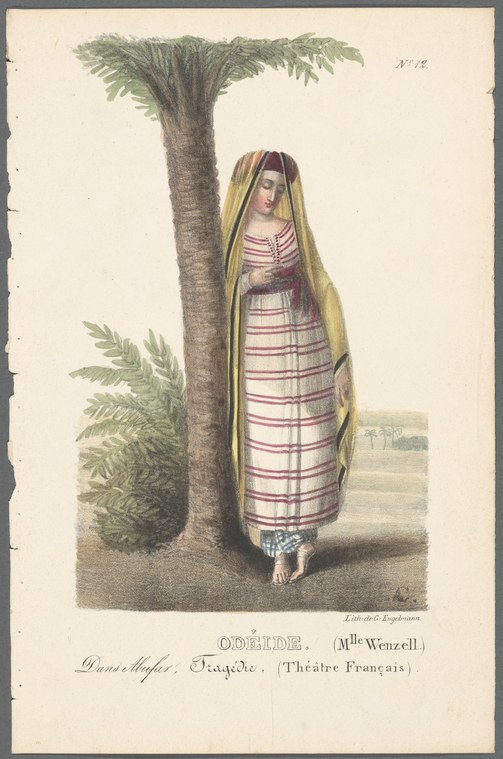Woman in Egyptian linen wrappings and gold veil standing barefoot before a tall date palm in a bare landscape.