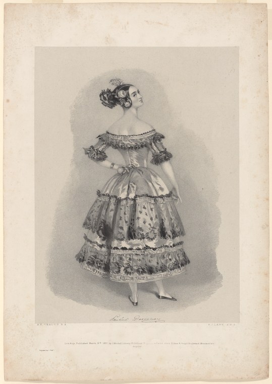 A young woman in a Romantic-era ballet costume stands in three-quarter profile, wearing a multi-tiered silk skirt and off-shoulder bodice with puffed sleeves.