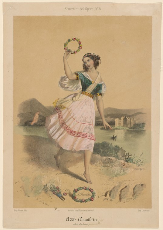 Young female dancer in green corsage and pink tulle skirt holds a flower wreath aloft, standing barefoot in a misty lakeside landscape.