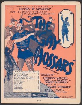 1909 theater poster with blue silhouettes of dancers in energetic poses against a coral background, advertising Hungarian dance and song.