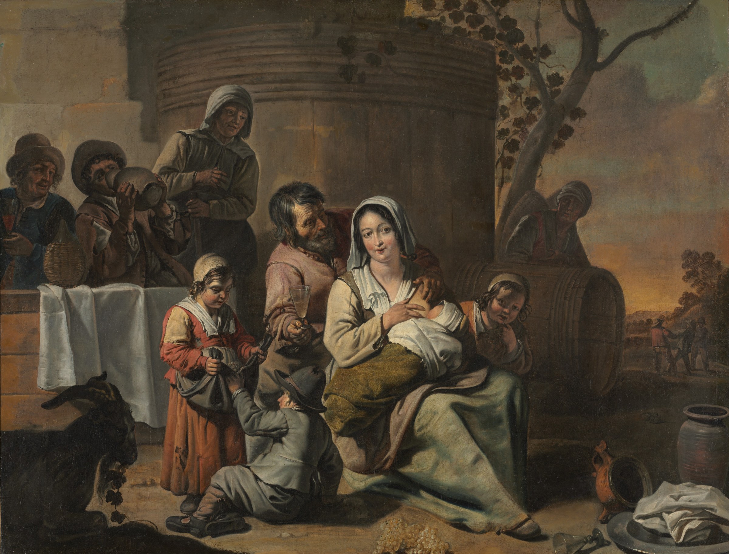 Woman seated indoors cradling an infant while a small child and five adults in rural dress gather around her, bathed in warm light.