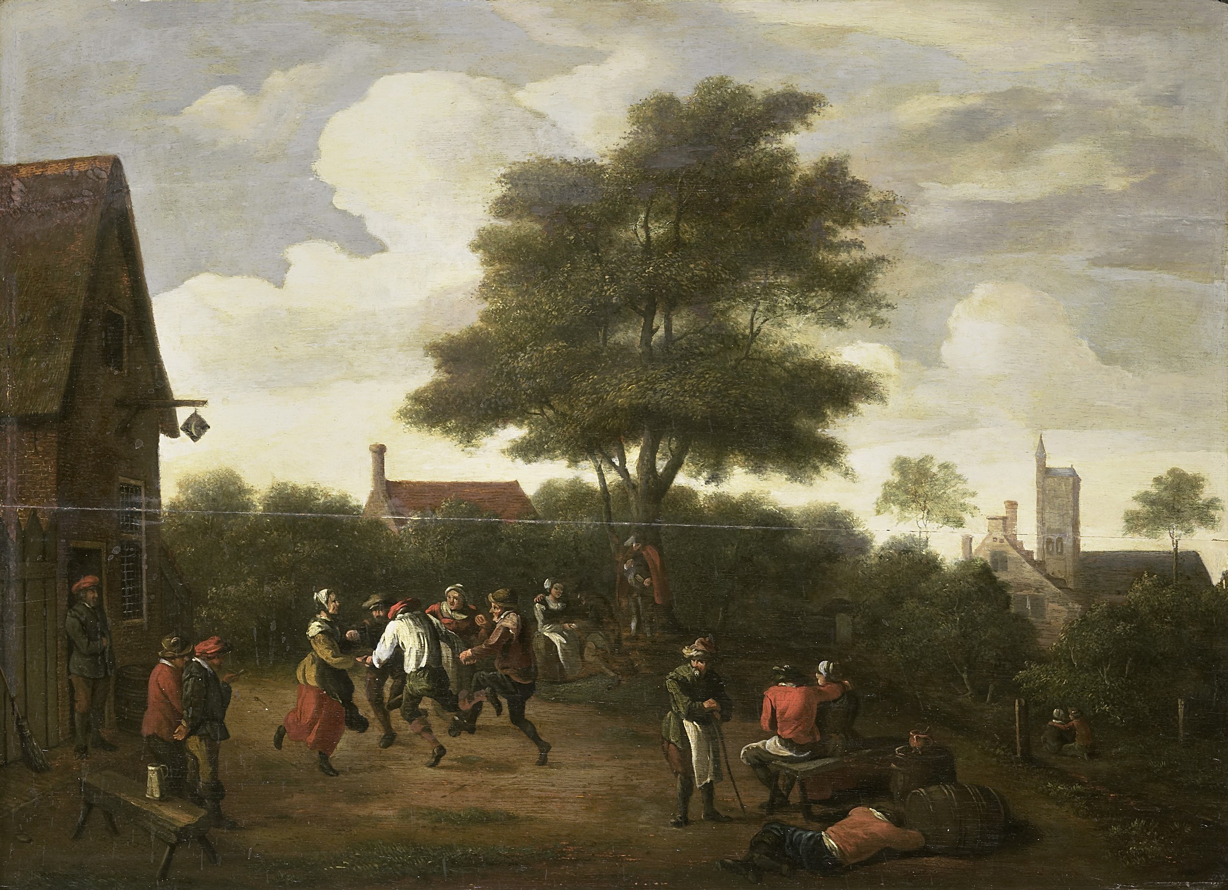Seventeenth-century Flemish painting of peasants dancing in a village courtyard, with a church tower visible beyond the enclosing wall.
