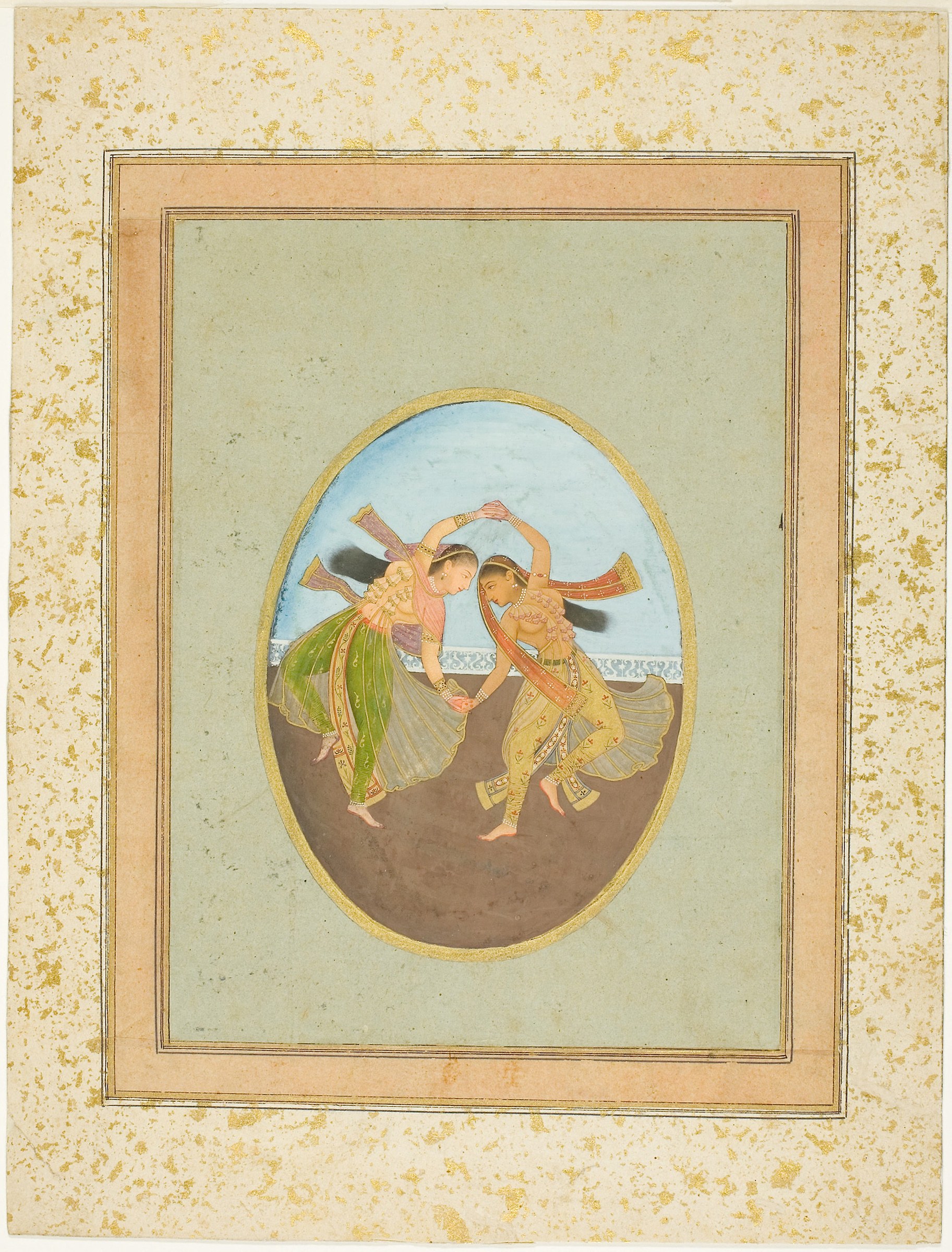 Two young female dancers in patterned South Asian dress, bent forward in synchronized movement, one playing a wind instrument, in a refined miniature painting.