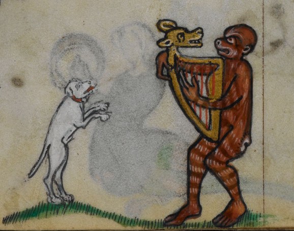 A brown monkey plays a stringed instrument while a small white dog stands on its hind legs before it in a dancing posture.