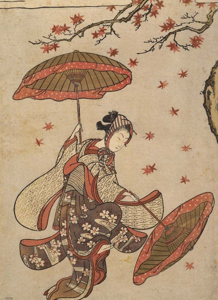Woman in patterned red and cream kimono holds a decorated parasol as autumn maple leaves fall around her.