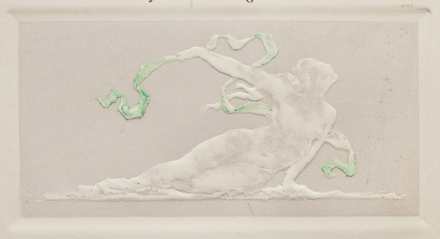 White relief figure of a reclining woman in an arched pose, surrounded by five green serpentine lines suggesting flowing costume