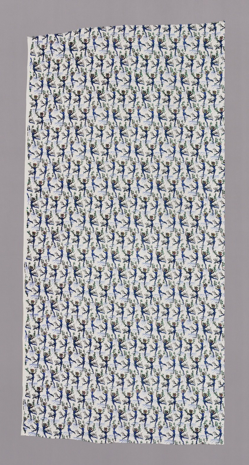 Rayon textile with repeating navy and green arabesque-posed ballet figures in vertical columns on cream ground.