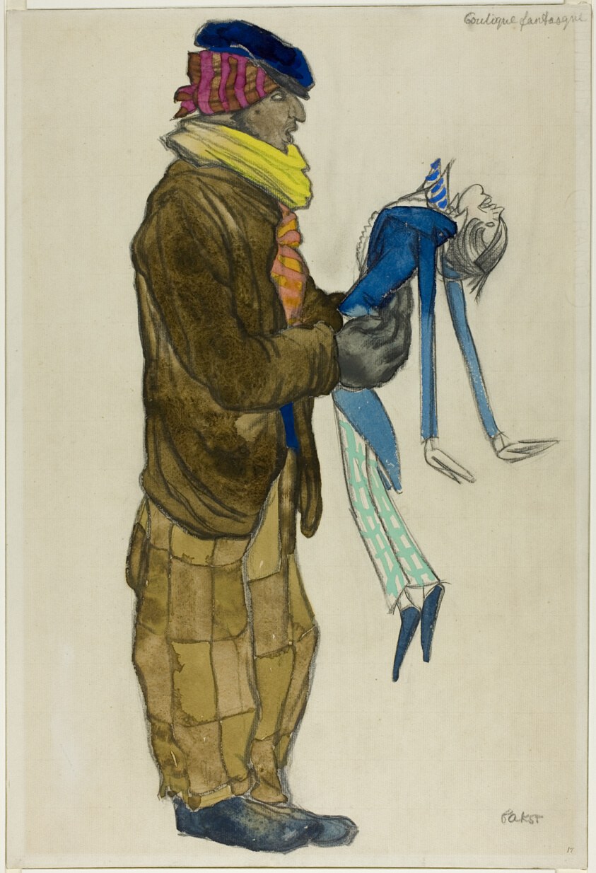 Costume design: gaunt man in brown coat and striped cap holds a limp marionette with blue costume and headdress.