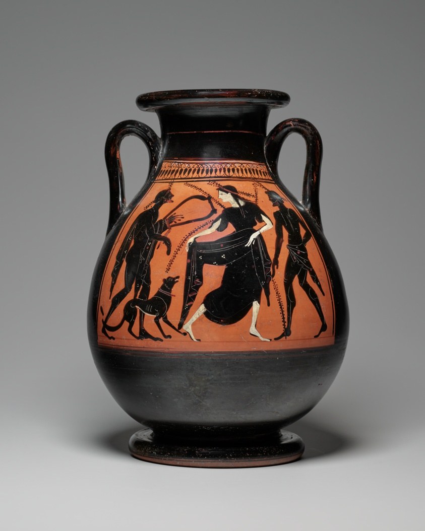 Black-figure terracotta storage jar showing athletic figures and a dog in silhouette against orange-red clay.