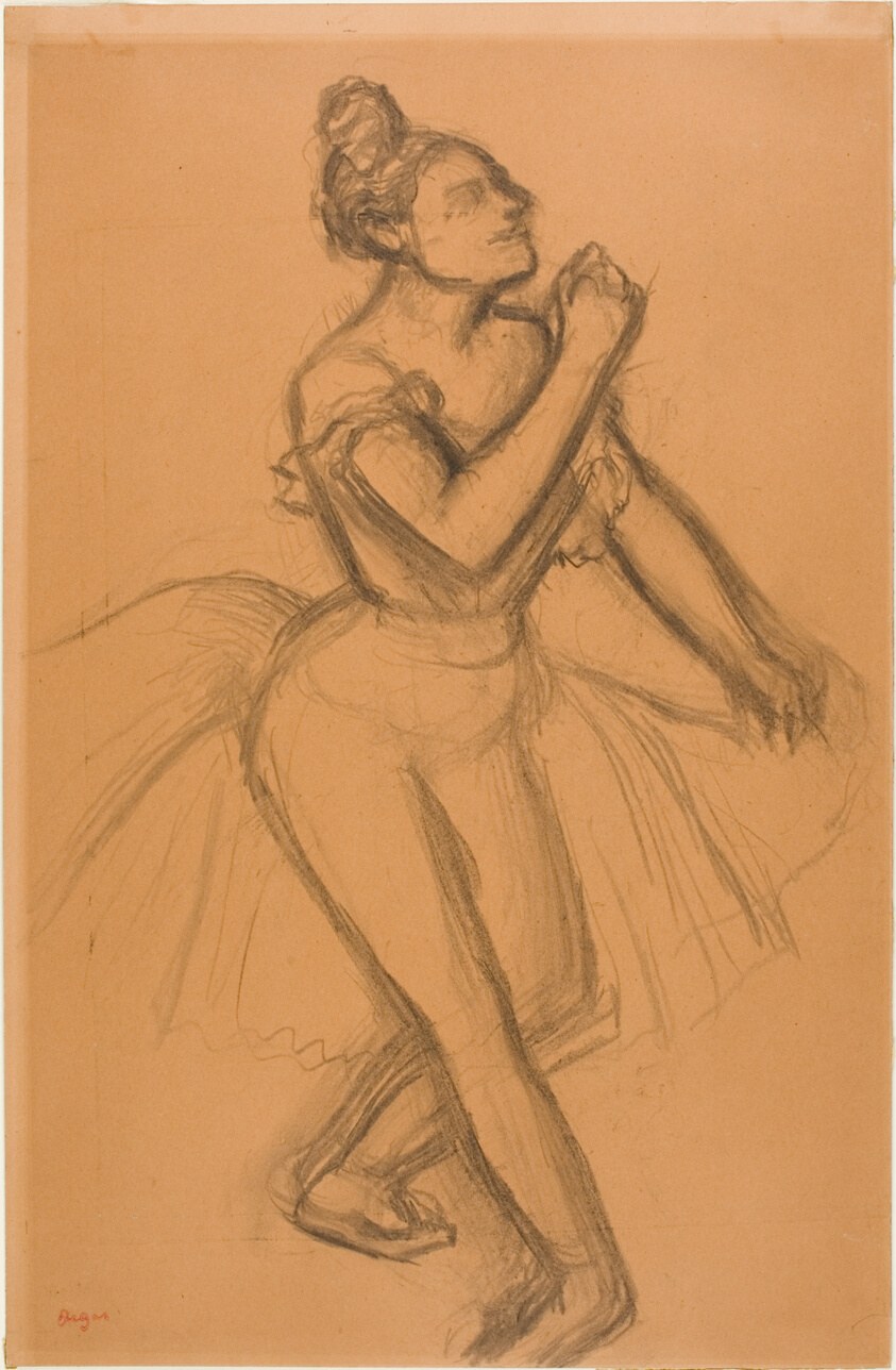 A female ballet dancer in pointe shoes arches backward in a supported pose, head tilted back, one leg extended upward.