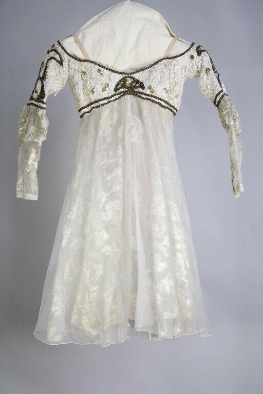 Cream silk sleeveless dress with gold-embroidered shoulder piece and draped short sleeves, high waistline, columnar skirt; Romantic ballet costume design.