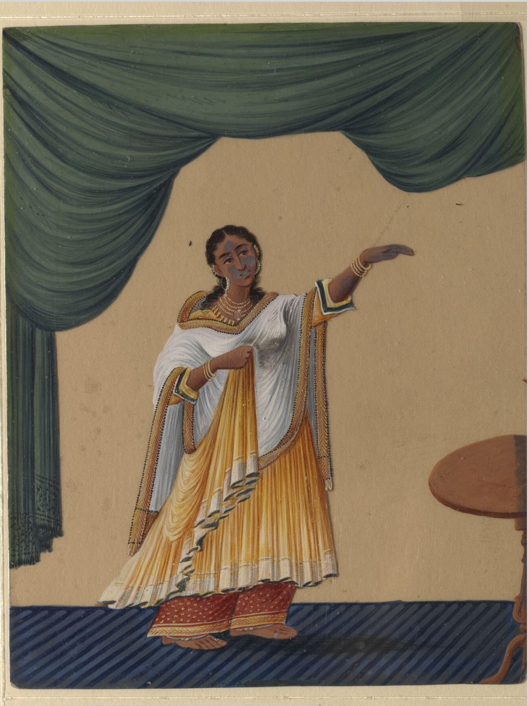 Woman in classical white and gold dress stands on blue platform, right arm extended, beneath draped green curtains against pale background.