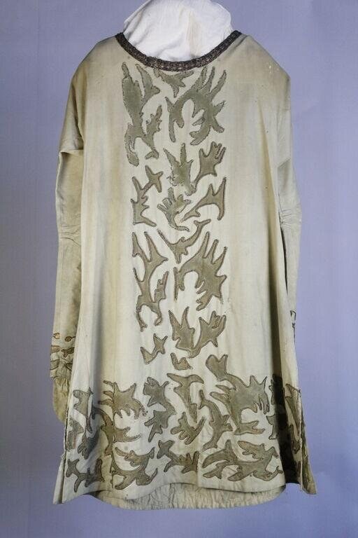 Cream linen robe with olive-green appliqué flames covering the back, sleeveless, full-length theatrical costume.