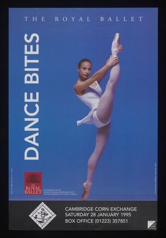 Male ballet dancer in white leotard and pink pointe shoes, extending right leg high in arabesque against a blue background.