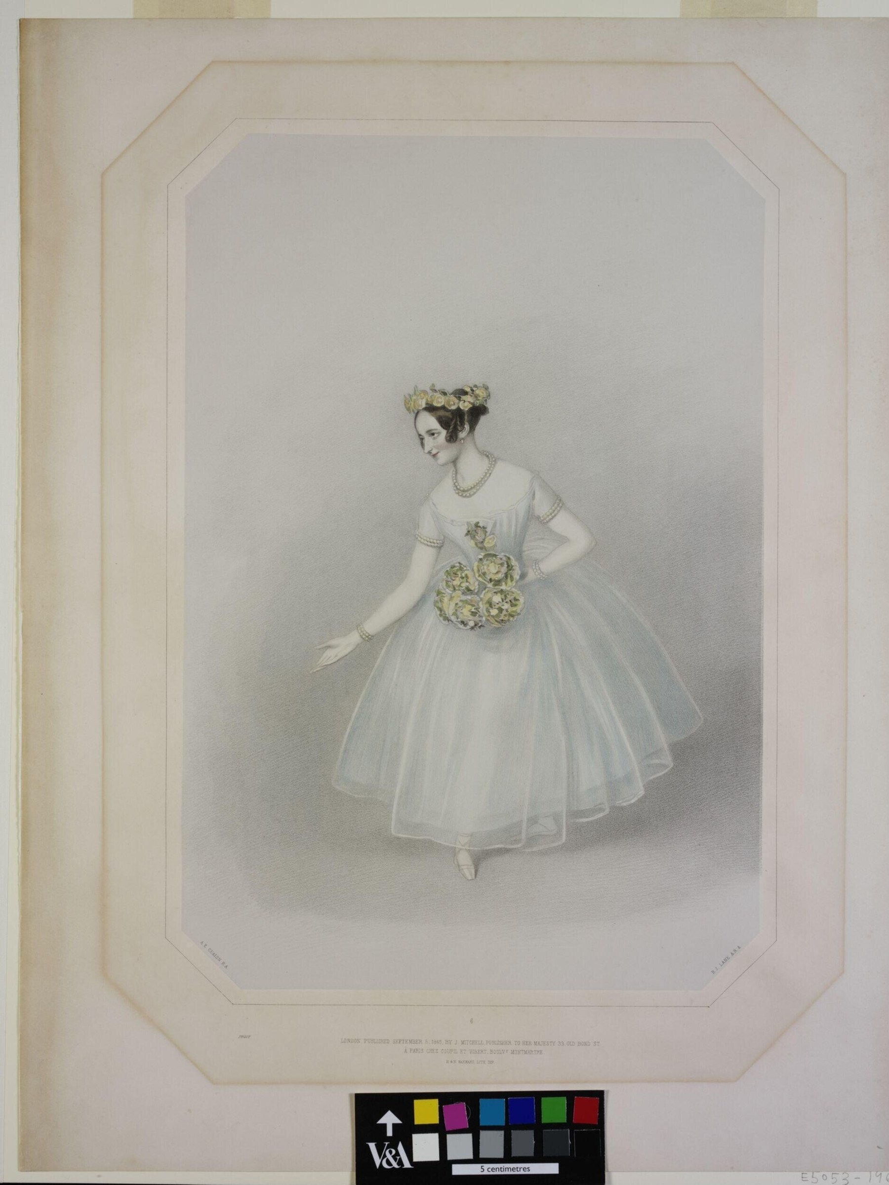 A woman in a white tulle ballet dress with floral crown stands in a graceful pose, one arm extended, against a neutral background.