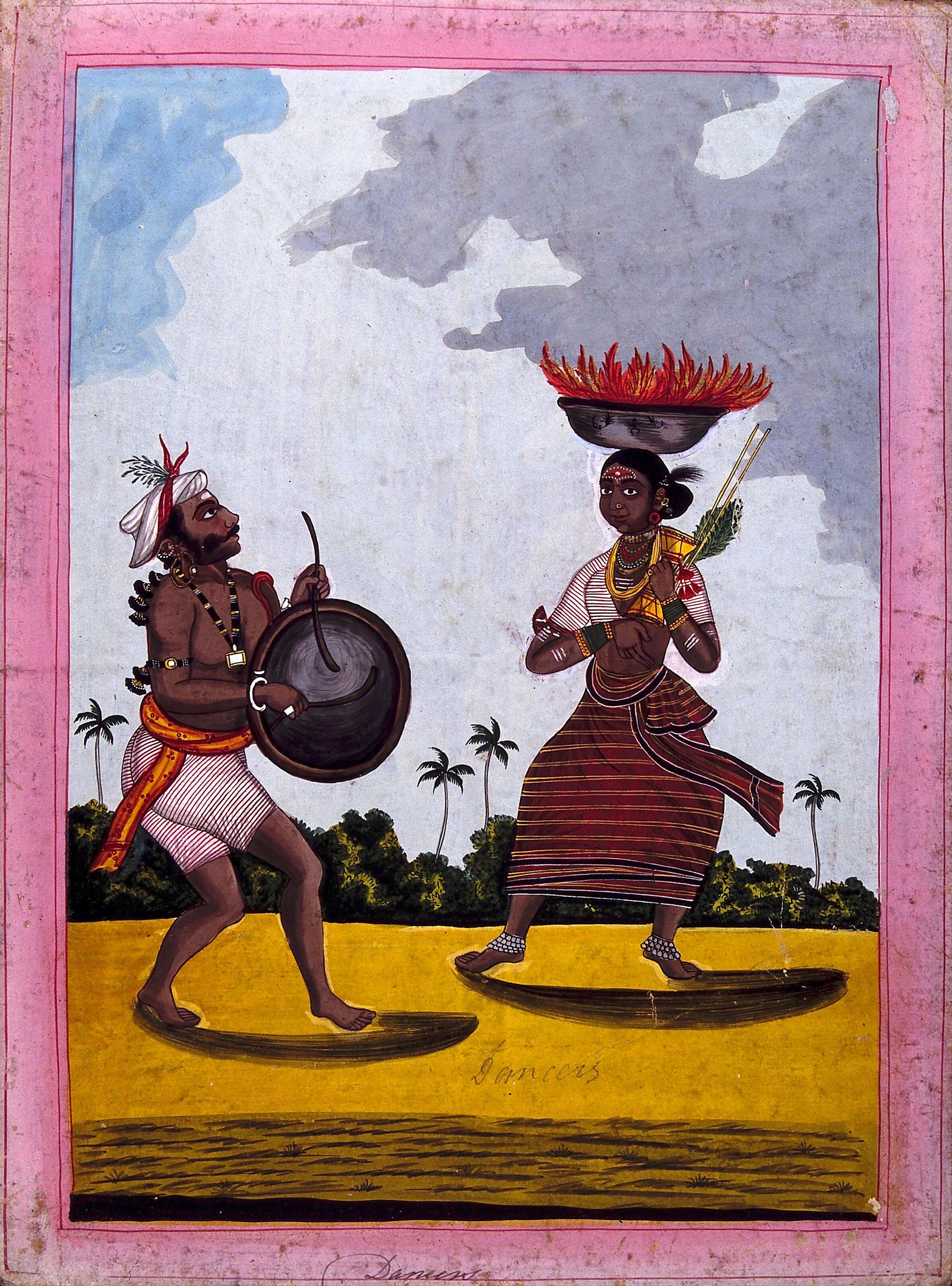 Two dancers in vibrant costume: a man in white headwrap with red plume holding a shield; a woman with red feathered headdress holding a staff, both shown