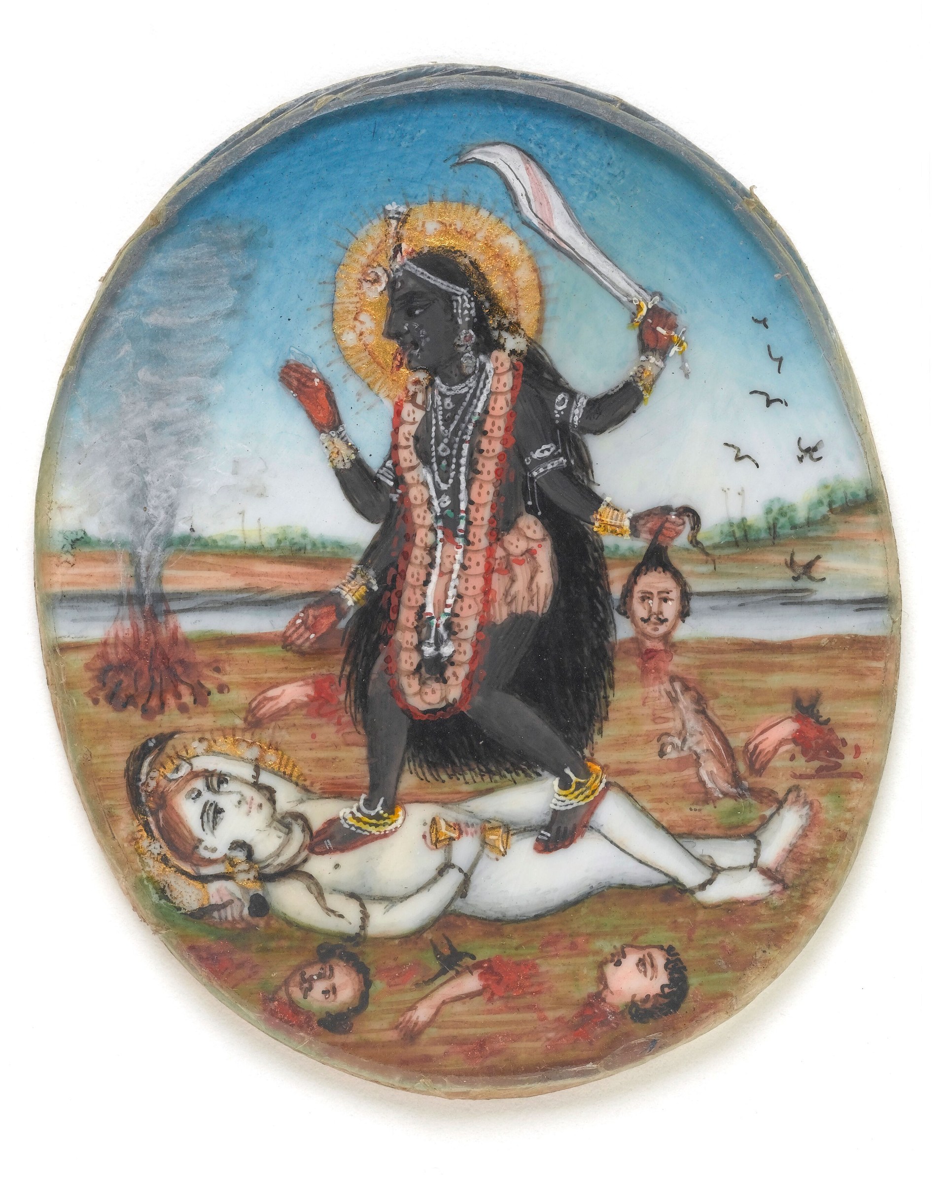 A dark-skinned deity with a golden halo stands with raised sword above a pale recumbent figure, surrounded by severed heads and attendants in a riverside