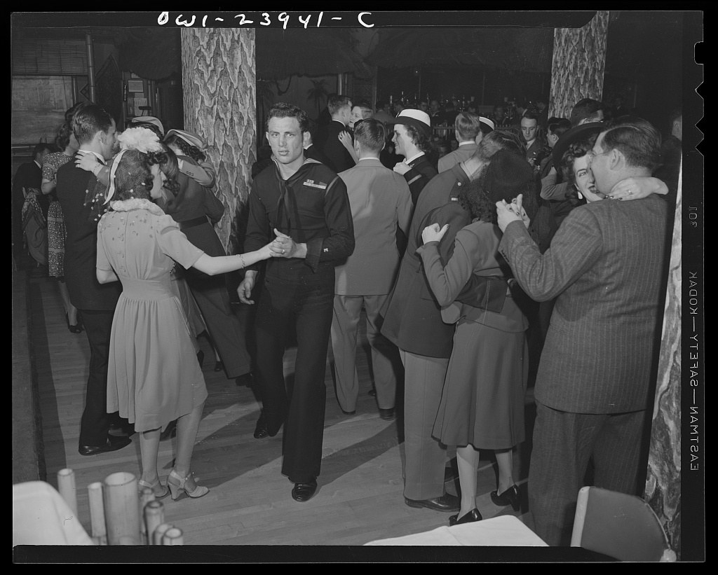 Crowded interior of the Hurricane Ballroom in 1943 with Navy servicemen and civilians dancing to Duke Ellington's orchestra.