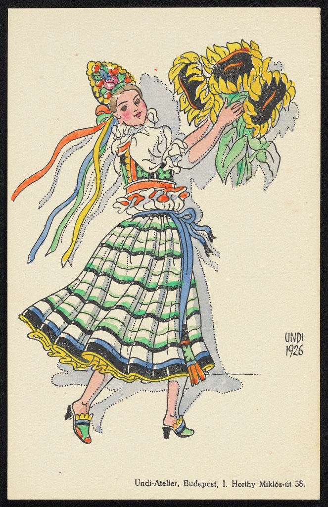 Woman in Hungarian folk costume holding sunflowers, wearing striped skirt and floral headdress with flowing ribbons.