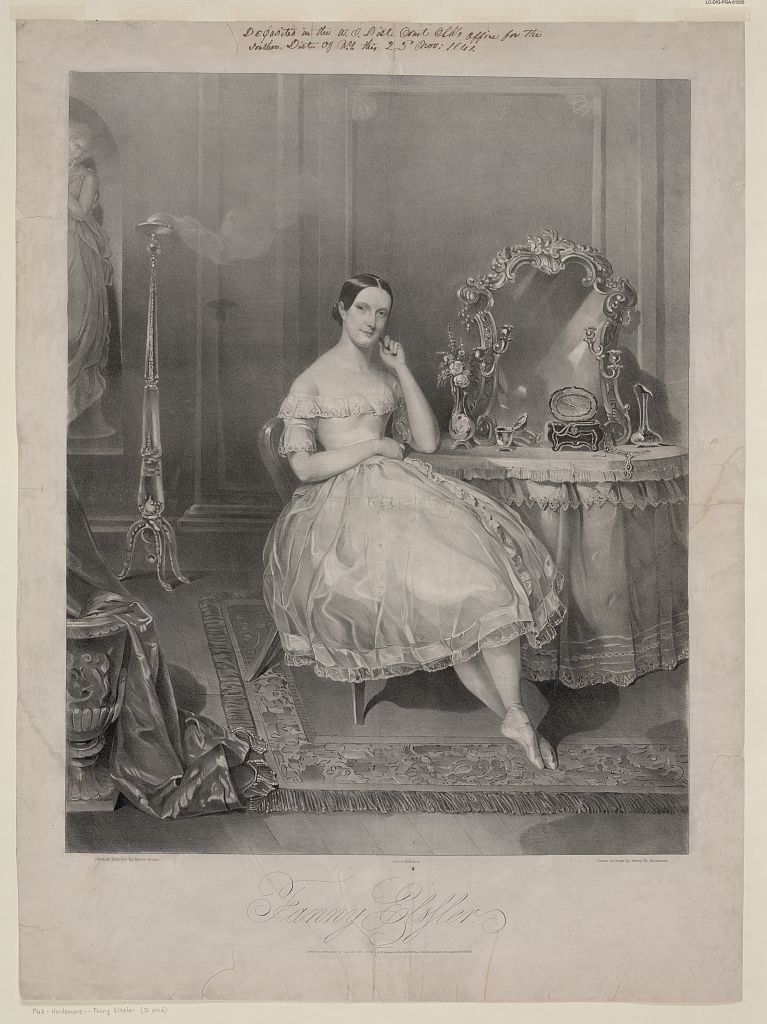 A woman in a white ball gown sits at a dressing table before an ornate mirror in a luxurious interior, hand raised to her face in a pose of contemplation.