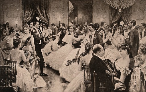 A man is playing a tambourine as couples are dancing in a ba